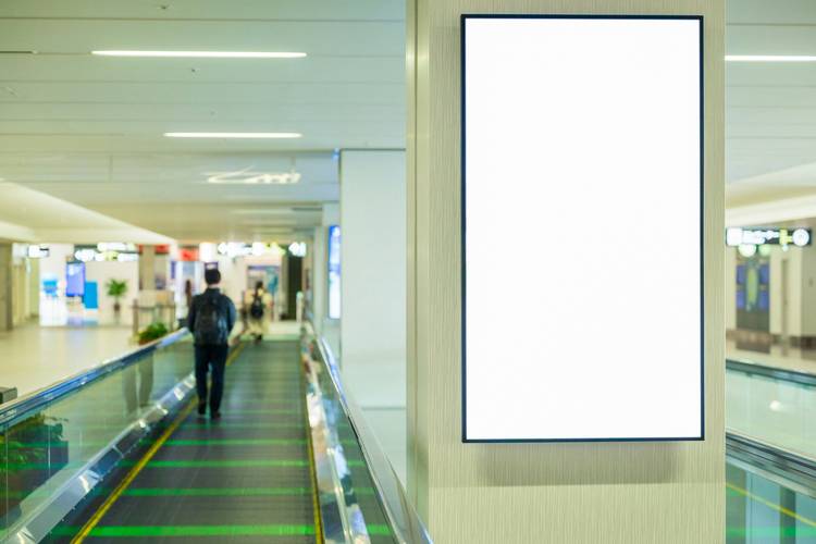 Shopper scanning an Air Miles card during grocery checkout
