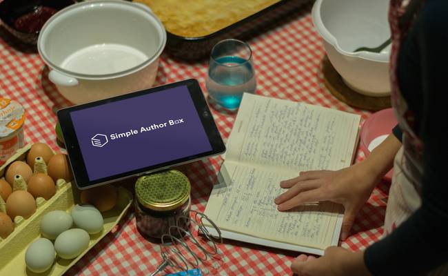 Canadian mom organizing coupons in a binder and digital app at the kitchen table