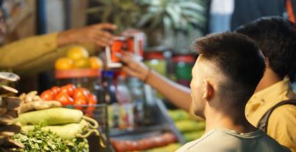 Canadian shopper using a cashback app with coupons for extra grocery savings