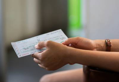 Family reviewing grocery receipts and savings with coupons in Canada