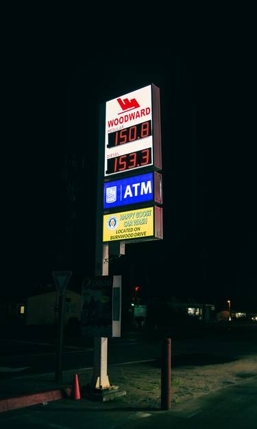Fuel price sign at a Canadian gas station showing changing prices
