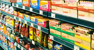 Organized binder and digital app for tracking grocery coupon expiry dates in Canada