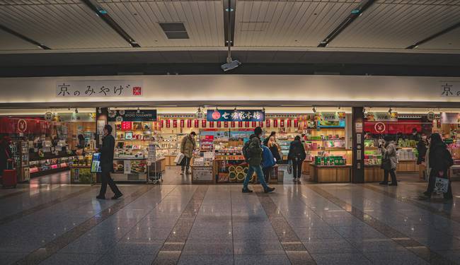 Canadian family using grocery loyalty cards at supermarket checkout