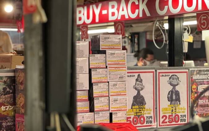 Canadian Tire store aisle with shoppers using printable coupons and the Triangle Rewards app at checkout