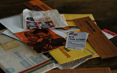 Envelopes and an accordion file labeled by store and date, ready for a quick Canadian grocery run