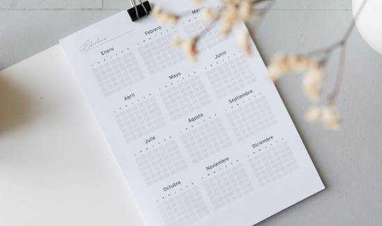 A calendar with coupons and a coupon organizer for tracking expiry dates
