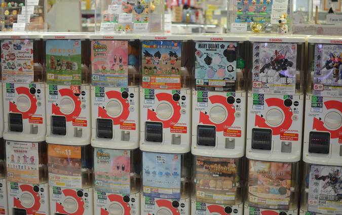 Canadian family stacking digital and paper coupons at a grocery store checkout