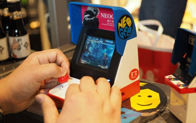 Canadian shopper using a mobile app for digital coupons in a grocery store aisle