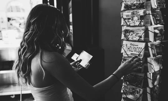 Canadian shopper searching for grocery coupons on a mobile app and printing at home