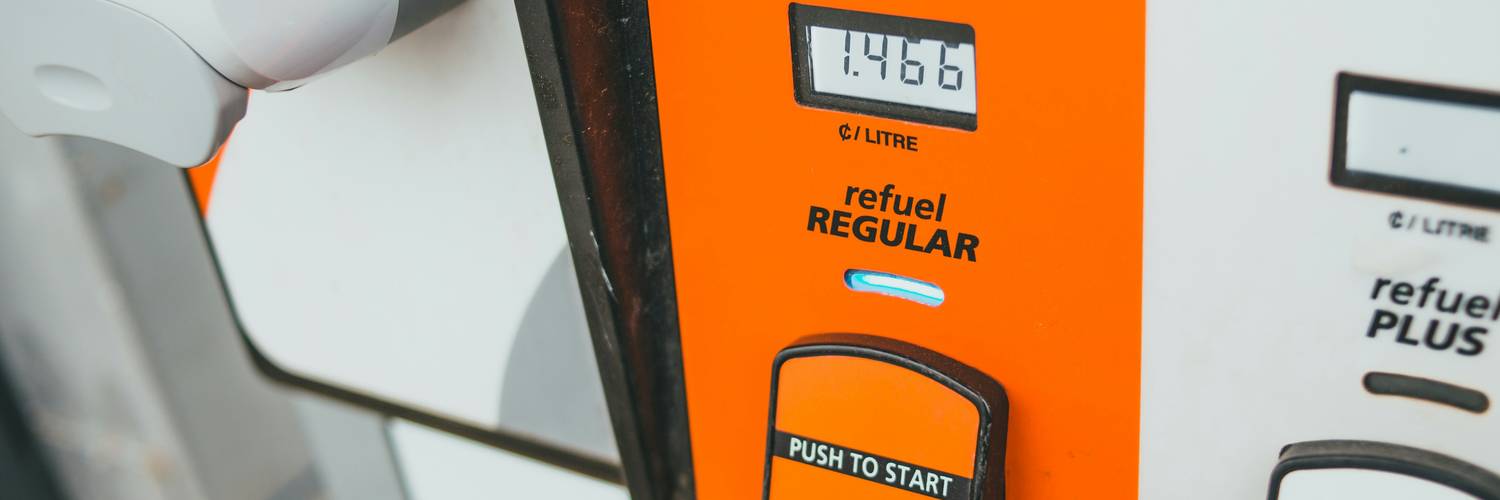 Canadian driver scanning a fuel-rewards card while refuelling