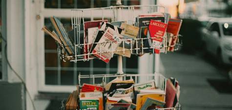 Coupon organizer, binder, or app being used by a Canadian grocery shopper