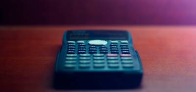 Calculator and grocery coupons estimating annual savings in Canada