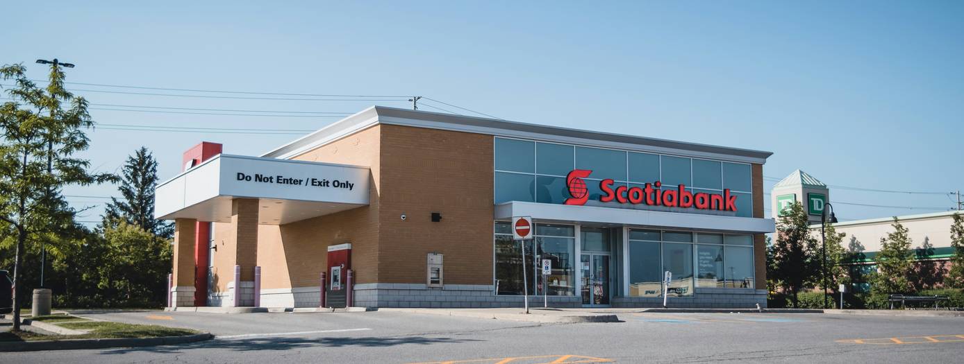 Canadian shopper presenting a Home Depot coupon at checkout