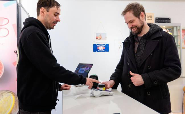Shopper scanning PC Optimum card at Loblaws self-checkout
