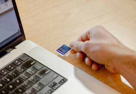 Loblaws shopper redeeming digital coupon and scanning PC Optimum card at grocery checkout
