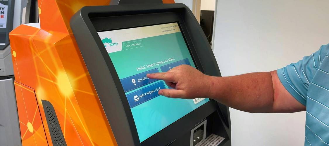 Canadian shopper scanning Metro app for digital coupon savings at checkout