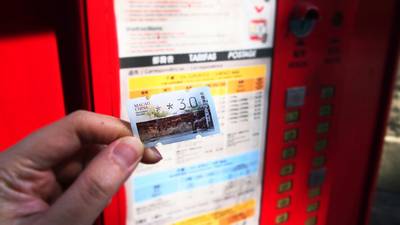 Canadian grocery shopper calculating Metro digital coupon and flyer savings on their phone