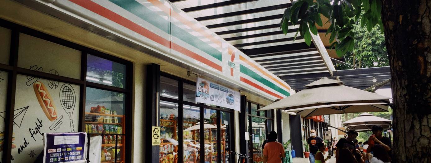 Wide view of Metro supermarket aisle with shopper holding coupons