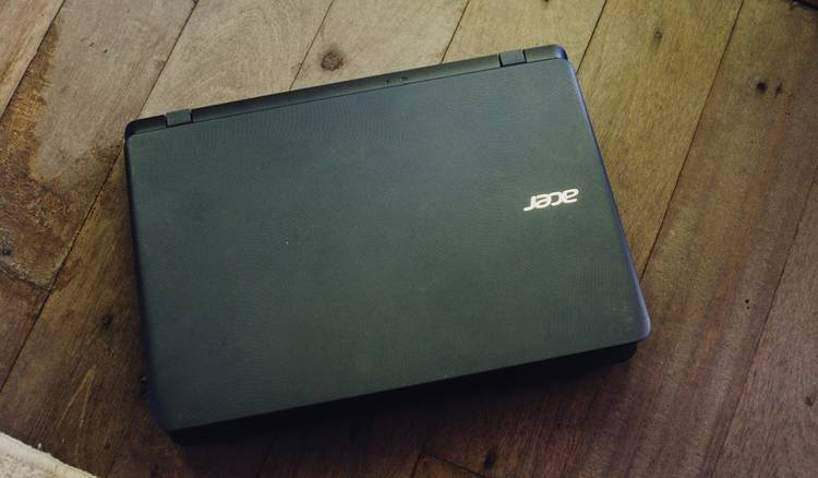 Shopper unboxing refurbished laptop purchased in Canada
