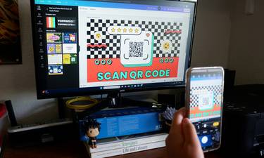 Person scanning PC Optimum app to stack loyalty points