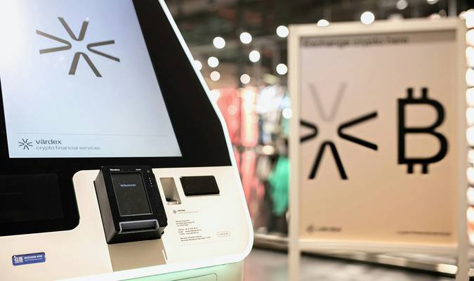 Canadian shopper scanning PC Optimum card at supermarket checkout for points and rewards