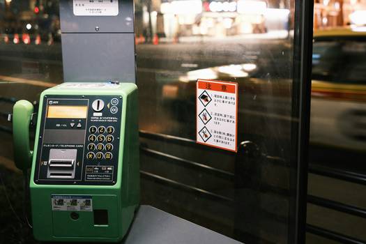 A calculator and Canadian grocery receipts next to flyers for price matching