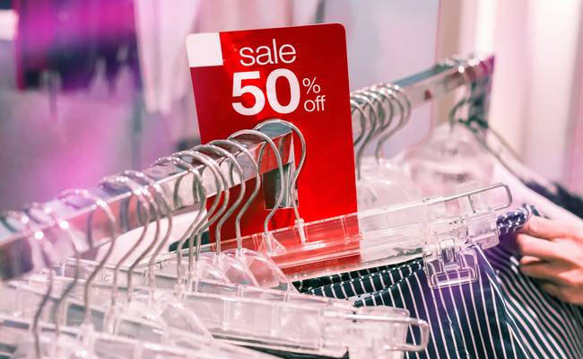 Canadian shopper printing retail coupons at home to save on store purchases