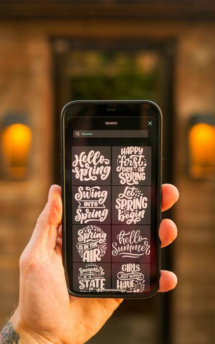 Smartphone displaying Reebee app flyer grid and shopping list features