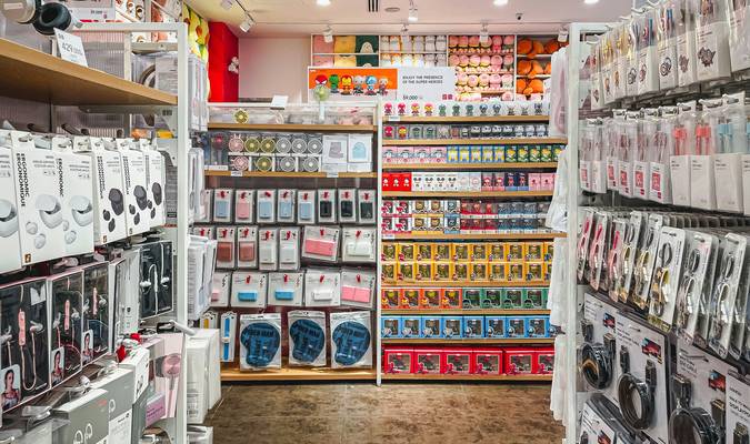 Canadian shoppers browsing hardware store aisles for home improvement deals and coupons