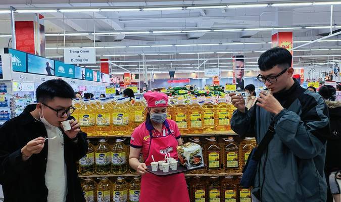 Family using coupons at a Canadian grocery store