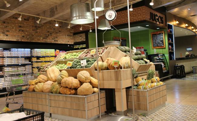 Shoppers using coupons at Save-On-Foods grocery store checkout in Canada
