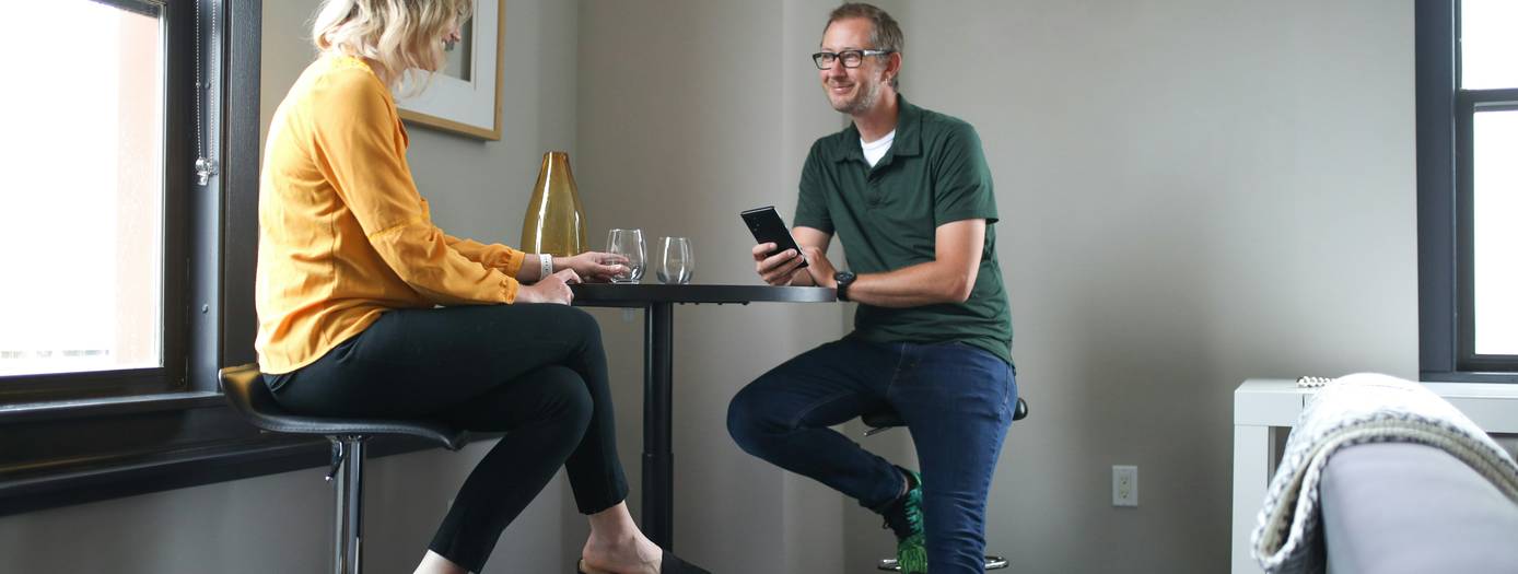 Canadian family reviewing Scene+ credit card options at a kitchen table