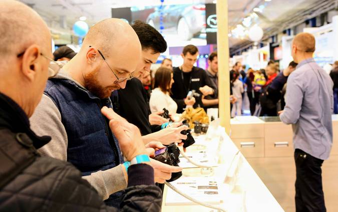 Shoppers choosing electronics and appliances at Best Buy Canada