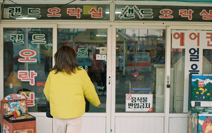 A happy shopper redeeming coupons at a Shoppers Drug Mart location in Canada