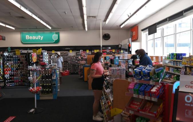 Shoppers Drug Mart shelves being restocked early morning
