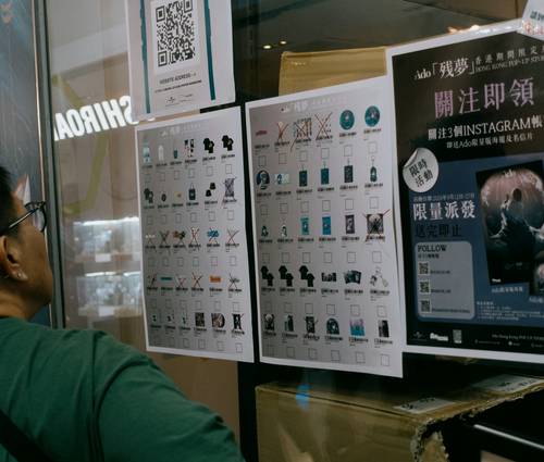 A shopper using printable and digital coupons at Shoppers Drug Mart's checkout