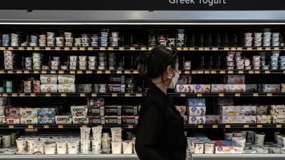 Sobeys Canada checkout showing digital and paper coupon stacking on a yogurt purchase