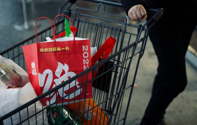 Canadian shopper using printable Sobeys coupons and Scene+ rewards at grocery checkout