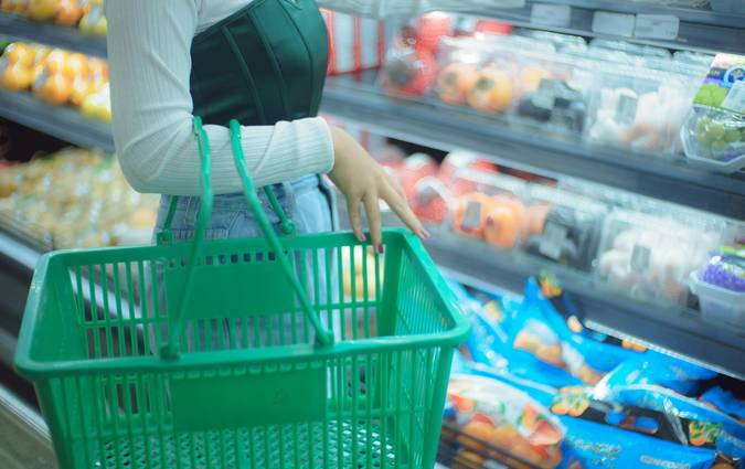 Canadian grocery shopper stacking coupons and using PC Optimum app at checkout for extra points