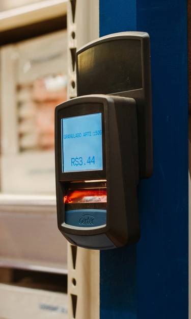 Shopper scanning digital coupon barcode at Shoppers Drug Mart checkout