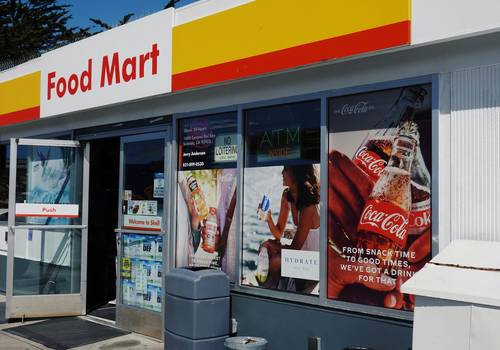 Walmart shopper redeeming printable and digital coupons at Canadian store checkout
